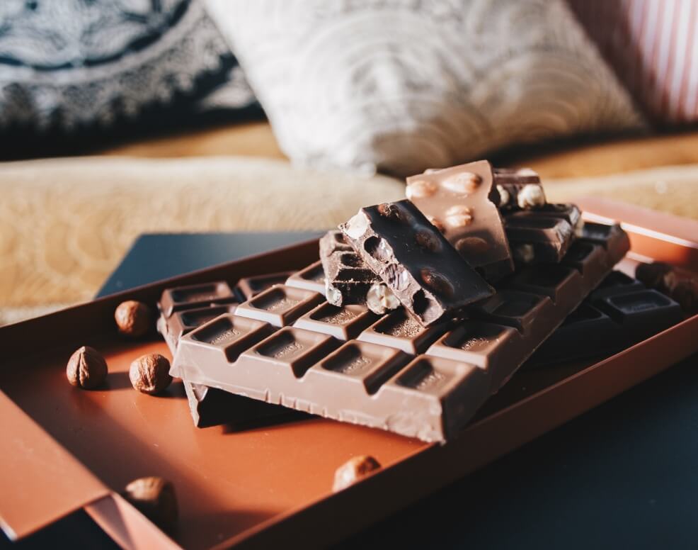 Bar and chunks of chocolate close up shot