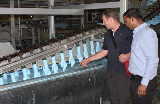 Eagle Protect CEO Steve Ardagh checks nitrile glove production line